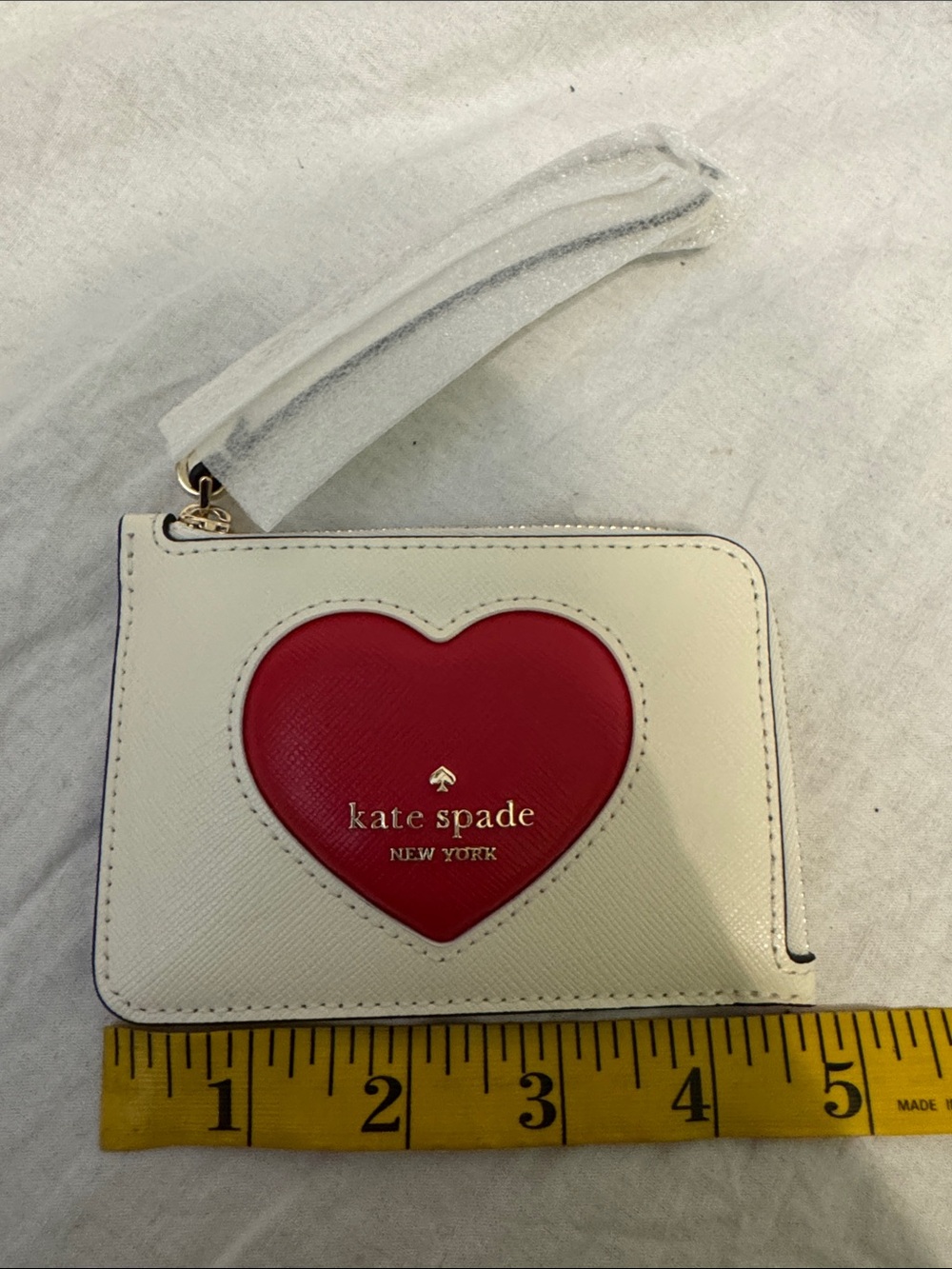kate spade White Wristlet Card Case with Red Heart Accent
